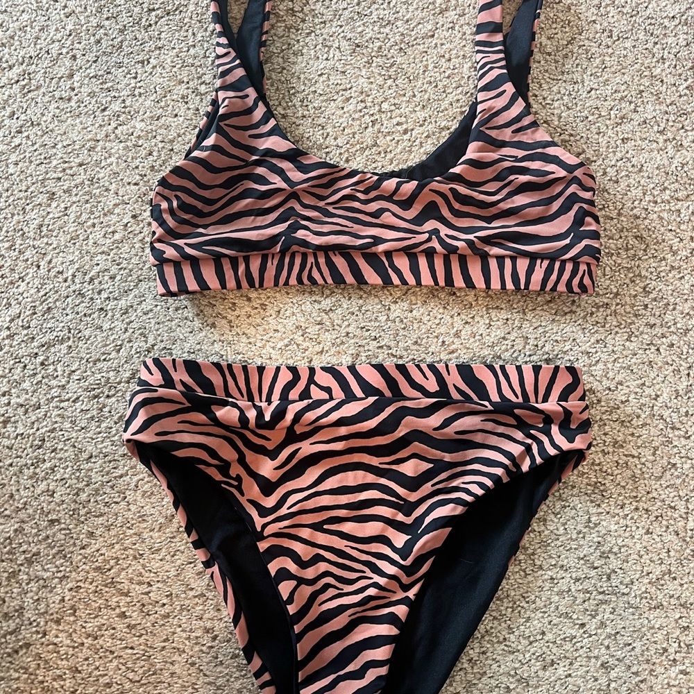 Blushing brunette tiger stripe black and mauve bikini